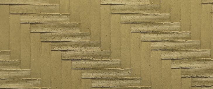 Rattan Knit flexible clay cladding with a deep basket-weave relief, a texture that would need cutting to turn a corner in a rigid material
